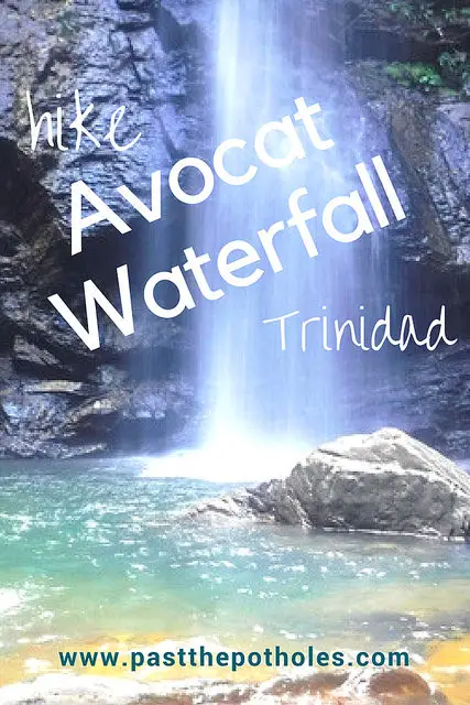 Tall waterfall falling into turquoise water and rocks with text: Hike Avocat Waterfall Trinidad