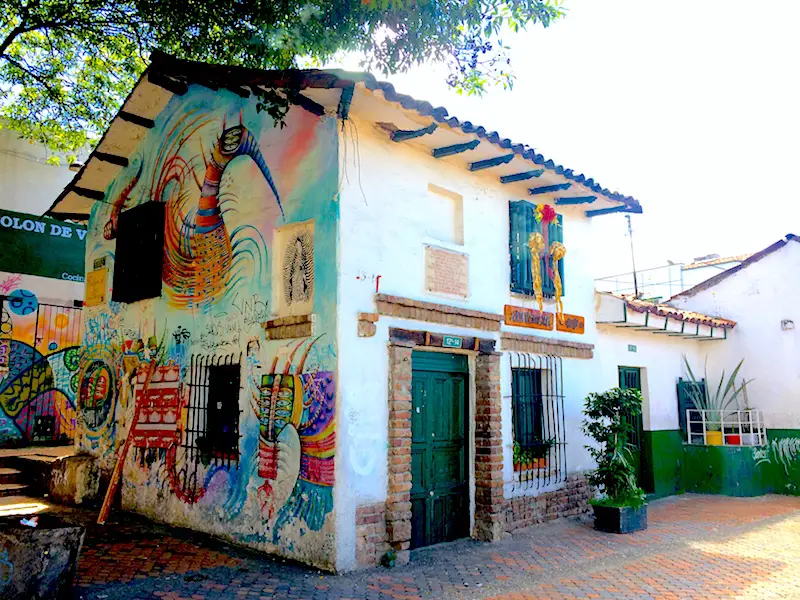 An old building covered in street art in Bogota, Colombia.