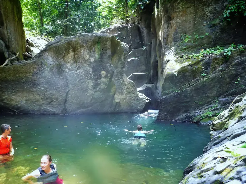 Swimming to a waterfall in Three Pools, Trinidad