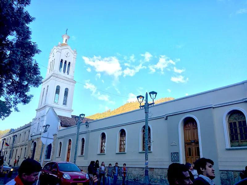 White church building with blue sky in Usaquen, Colombia.