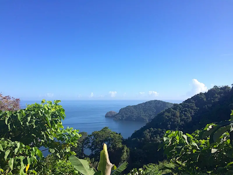 View of Caribbean Sea over lush mountains from Trinidad North Coast Road