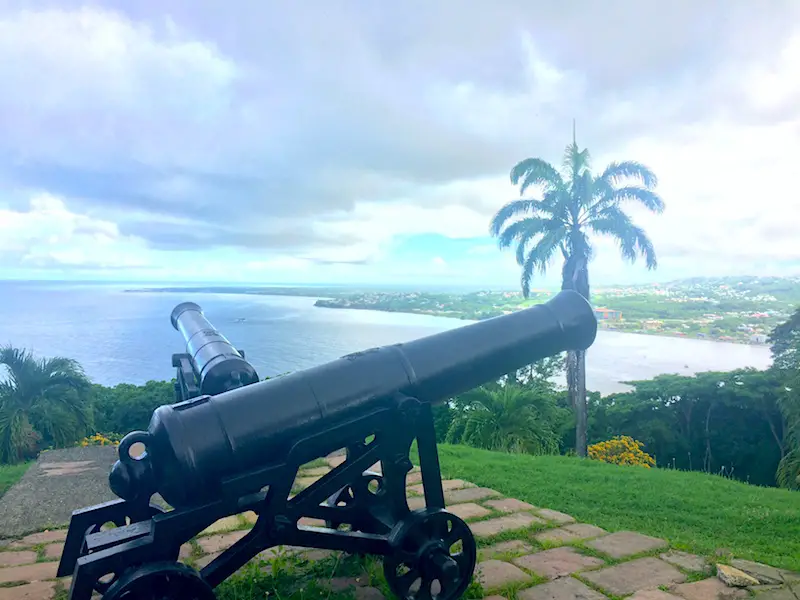 Looking over two canons to the Tobago coast and Caribbean Sea at Fort King George.