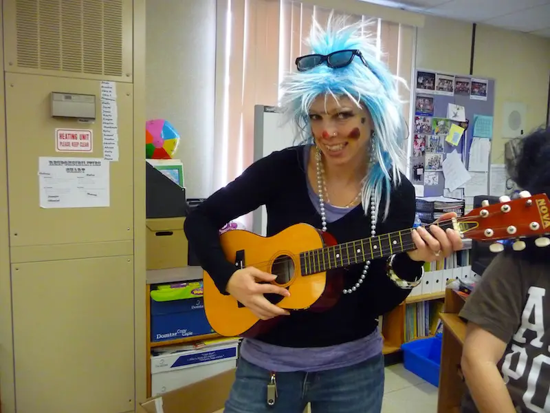 Teacher dressed up as funny rock and roll star.