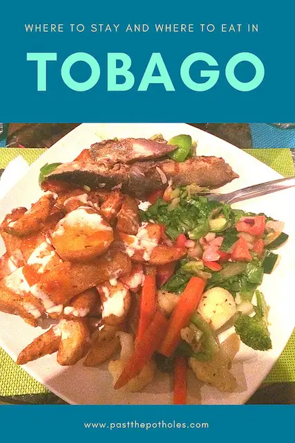 Plate of fresh fish, plantains, rice and salad with text: Where to stay and eat in Tobago.