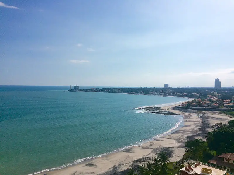 Emerald water and blue sky in bay of Nueva Gorgona looking to Coronado, Panama