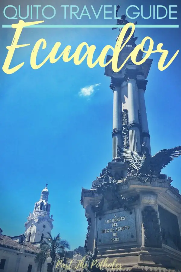 Tall statue with text: Quito Travel Guide, Ecuador.