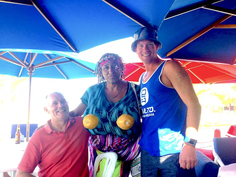Two men with a third man dressed as a woman in Manta, Ecuador.
