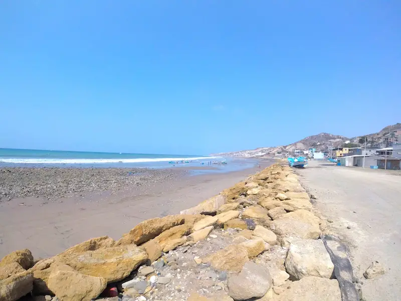 Looking down the rock break wall at the long beach of Santa Marianita, Ecuador.