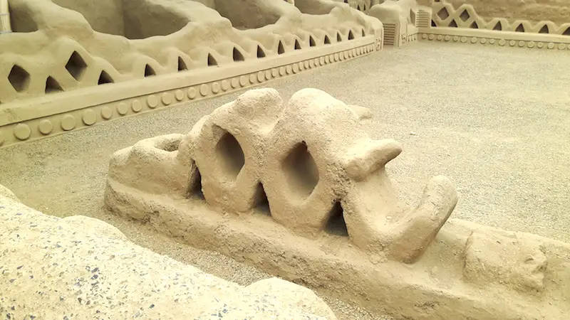 Close up of detail in adobe walls of Chan Chan pre-Incan ruins near Huanchaco, Peru