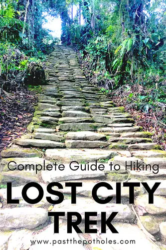 Stone steps leading to ancient ruins with text: Complete Guide to hiking the Lost City, Colombia.