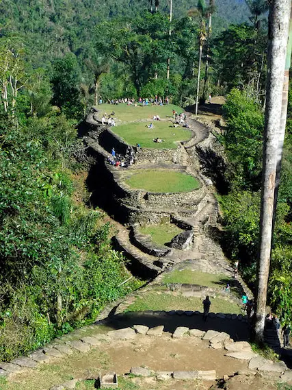Layered terraces filled with hikers at Lost City, Colombia.