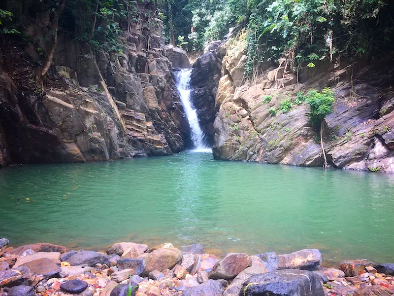 The Paria waterfall with a pool to swim in front surrounded by rocks.