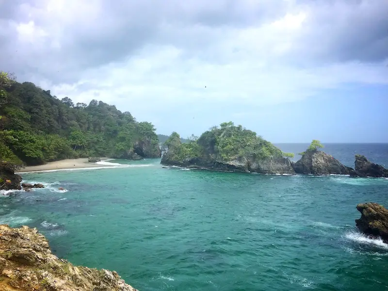 A small sandy cove surrounded by rocks at Paria Bay, Trinidad