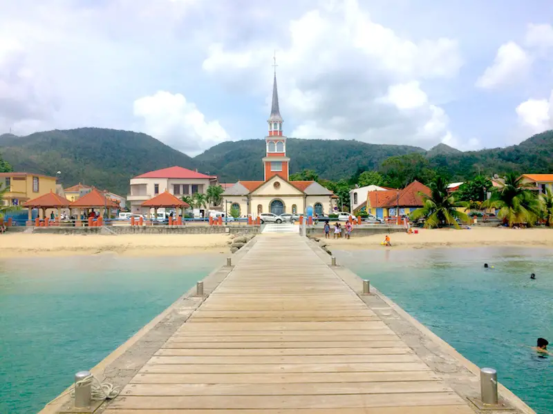 View of church and town of Anse d'Arlet from end of pier, Martinique.