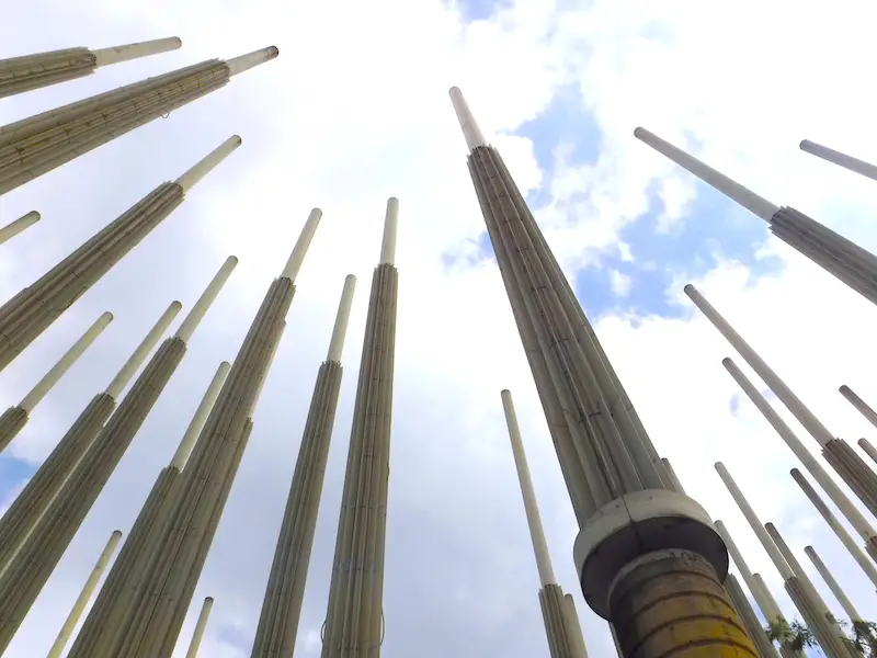 Looking up at the sky between many light posts in a Medellin plaza, Colombia.