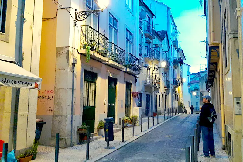 Twilight down a narrow street in Alfama district of Lisbon, Portugal.