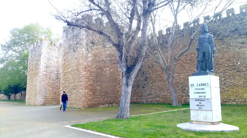 Man wandering around an old castle grounds in Lagos, Portugal