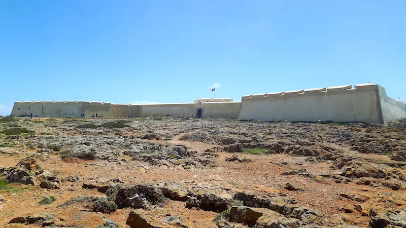 A low fort across scrubland in Portugal.