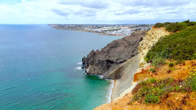 White cliffs meet black volcanic rock where the tectonic plates meet near Lagos, Portugal.