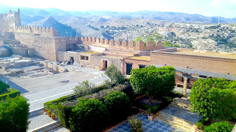 Looking down on the ancient alcazaba with mountains beyond in Almeria, Spain.