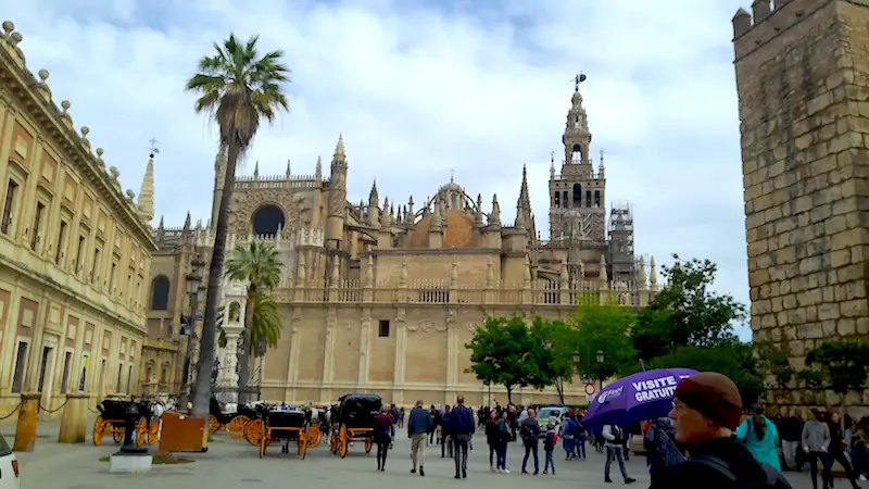 Plaza surrounded by grand buildings in Seville, Spain.