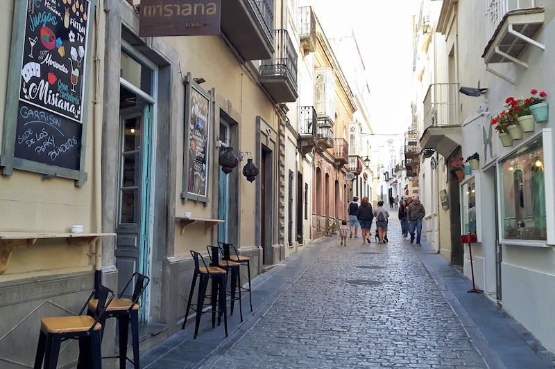 Narrow cobbled street in Tarifa old town, Spain.