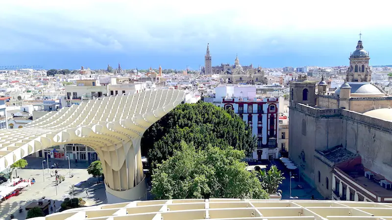 View of historic buildings from the top of setas de Sevilla, Spain.