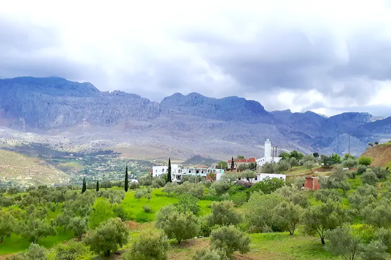 Scenery through the Atlas mountains and a small town on the road to Chefchaouen, Morocco.