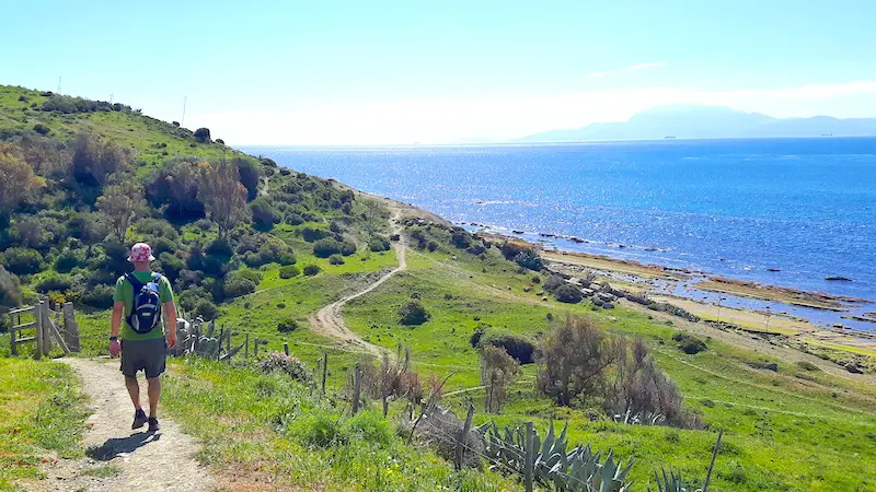 Man hiking along the coast in Tarifa, Spain.