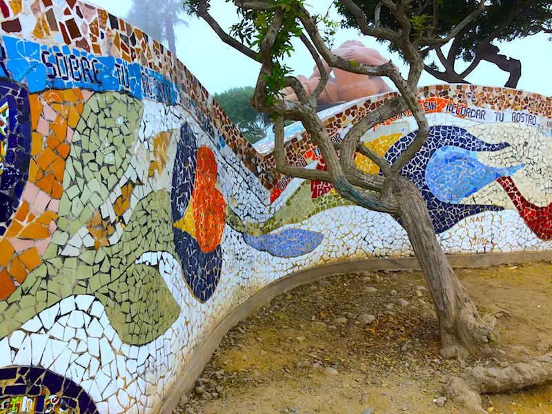 colourful mosaic wall with a twisted tree inside in Parque del Amor, Lima Peru.