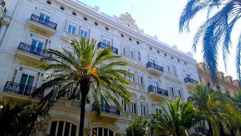 Beautiful grand architecture with palm trees in Valencia, Spain.