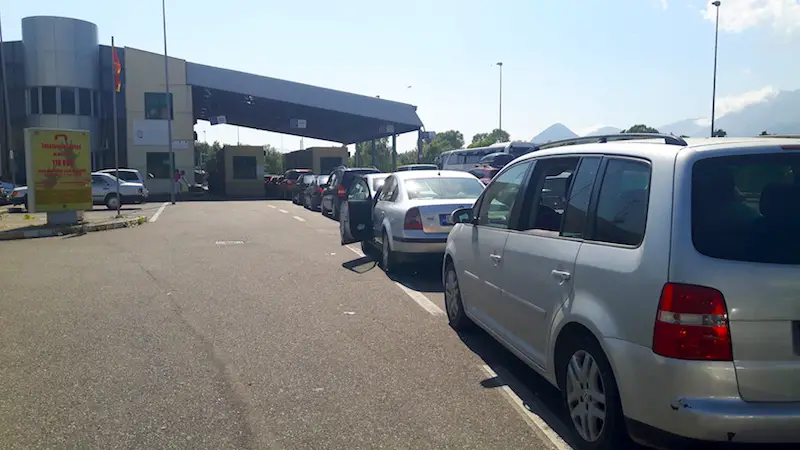 Line of cars at border between Albania and Montenegro.