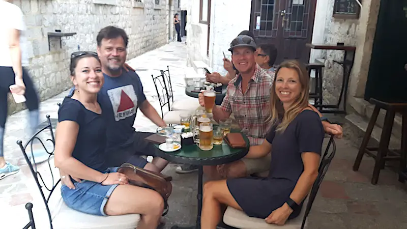 Friends having a drink in Kotor old town, Montenegro.