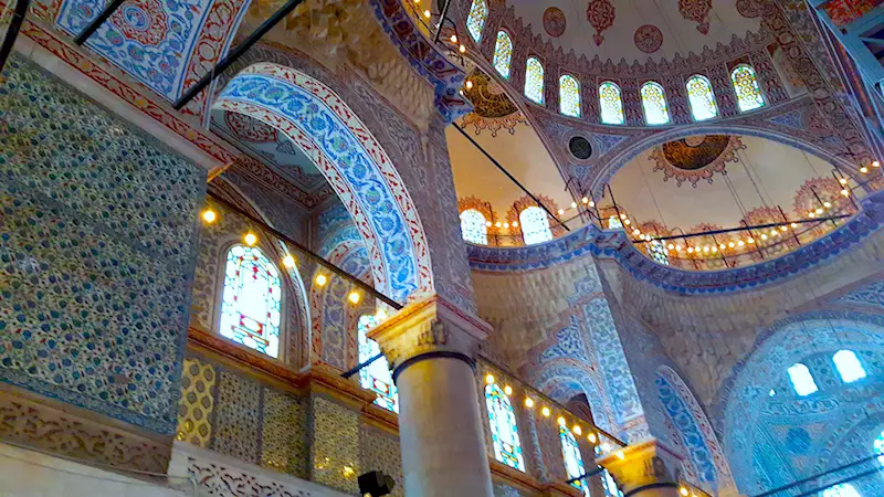 Intricately tiled, carved and lit inside of Blue Mosque in Istanbul, Turkey.