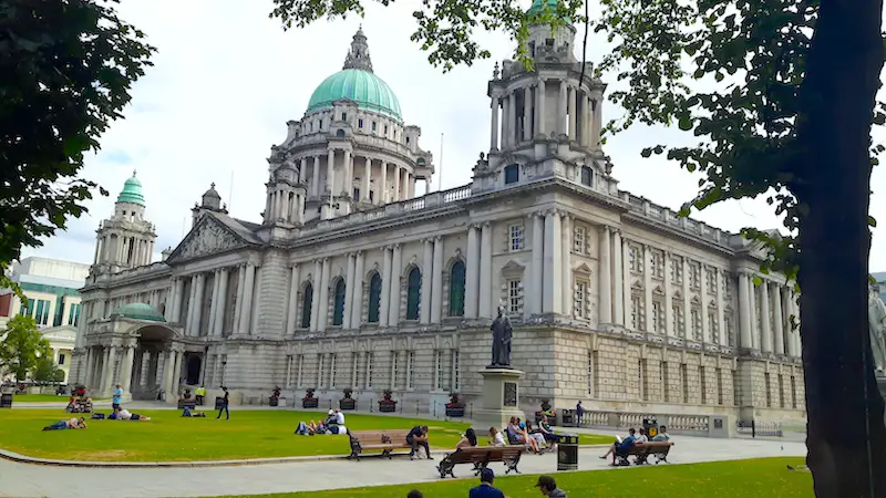 Ornate city hall with green dome roof in Belfast, Northern Ireland.