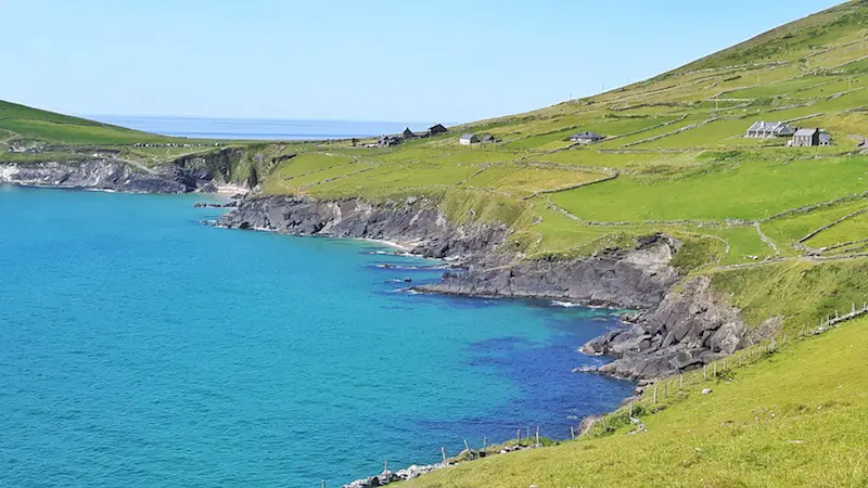 Impossibly blue water with green hills on the Dingle Peninsula, Ireland.