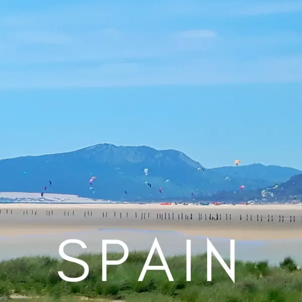white sand, mountains, kitesurfing in Tarifa, Spain
