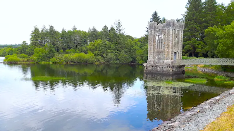 Tower built in the water surrounded by trees at Vartry Reservoir in Roundwood, Ireland.