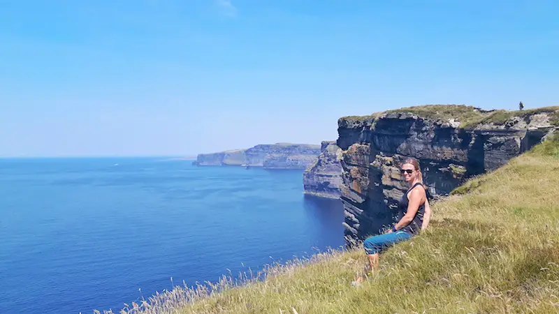 Sitting on the edge of the Cliffs of Moher in Ireland.