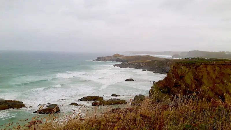 Stormy weather and rough seas in a sandy bay in Newquay, Cornwall UK.