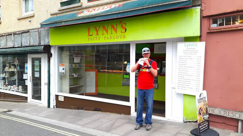 Man eating a Cornish pasty, Newquay, Cornwall UK