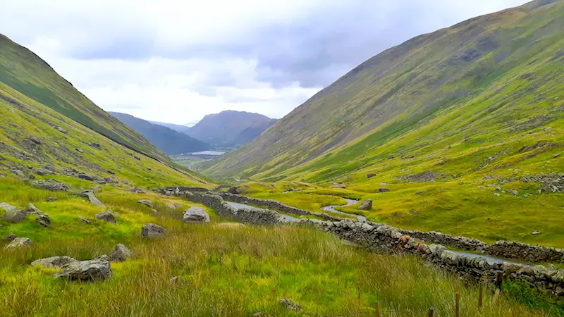 View towards lake between mountain peaks at Kirkstone Pass in Ullswater, Lake District, England.