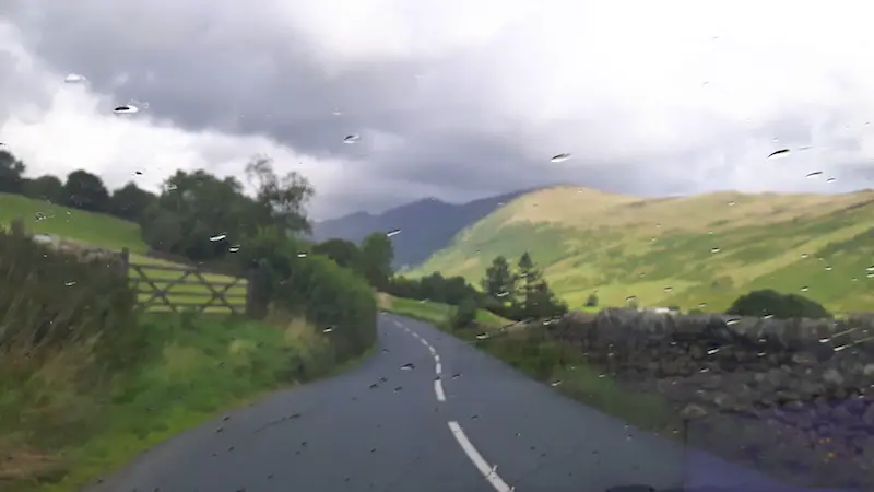 Raindrops on the window while driving down a narrow lane in the Yorkshire Dales, England.