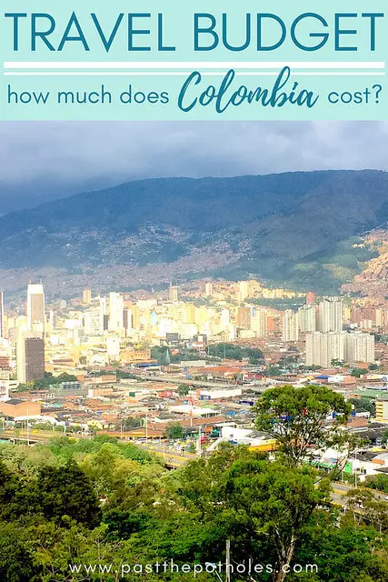 View of dense buildings in city of Medellin with text: Travel Budget, how much does Colombia cost?