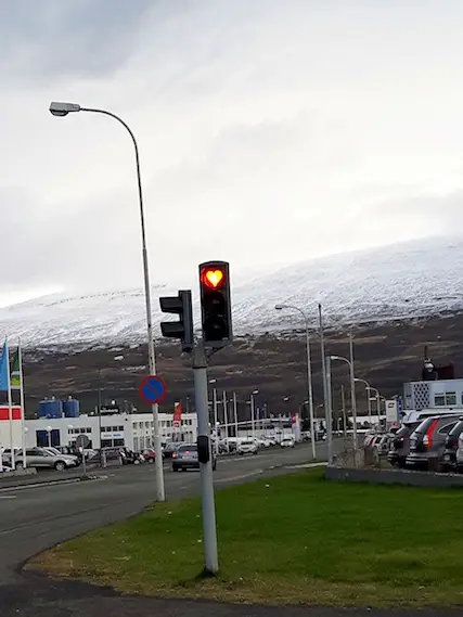 Traffic light in Akureyri, Iceland with a heart shaped red light.