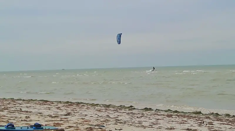 Man in the Gulf of Mexico kitesurfing alone in Progreso, Mexico.