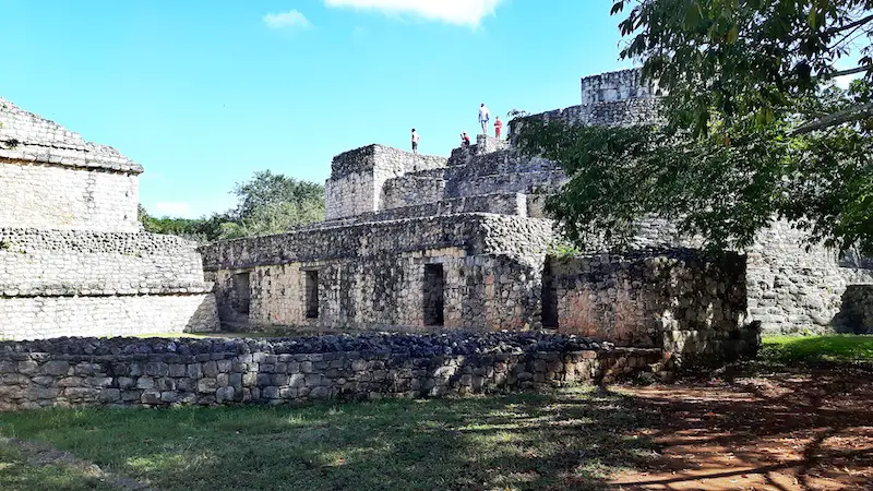 The oval temple with people at the top at Ek Balam mayan ruins, Valladolid Mexico.