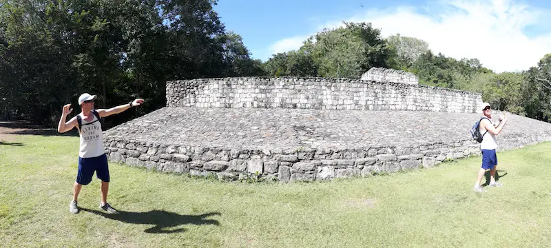 Man playing catch in ancient ball court, Ek' Balam ruins, Mexico