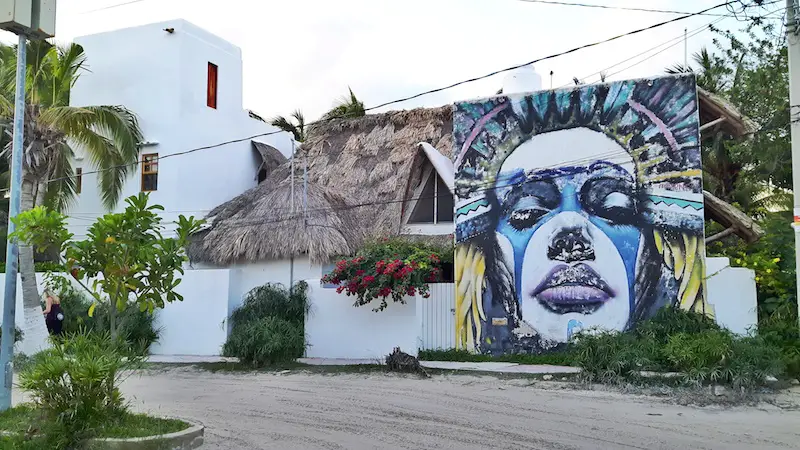 Street art on sandy street - a fun thing to do in Isla Holbox, Mexico