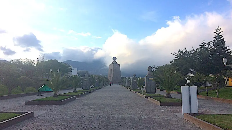 The stone Mitad del Mundo monument marking the equator line in Quito, Ecuador.